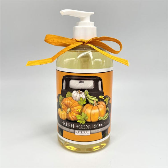 mary lake-thompson liquid soap 12 ounces in pump bottle with a bow tied around the top. label illustration of a black truck with pumpkins and gourds in the back.