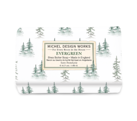 Michel Design Works shea butter soap bar, featuring elegant botanical packaging with detailed artwork of an evergreen forest theme.