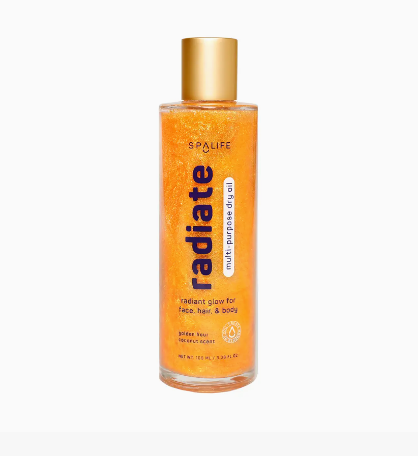 Glass bottle of golden sparkly My Spa Life Radiate body oil coconut scented