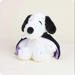 Plush toy resembling a vampire dog with a purple cape on a beige background