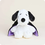 Plush Vampire Snoopy heating pad with purple cape on a beige background