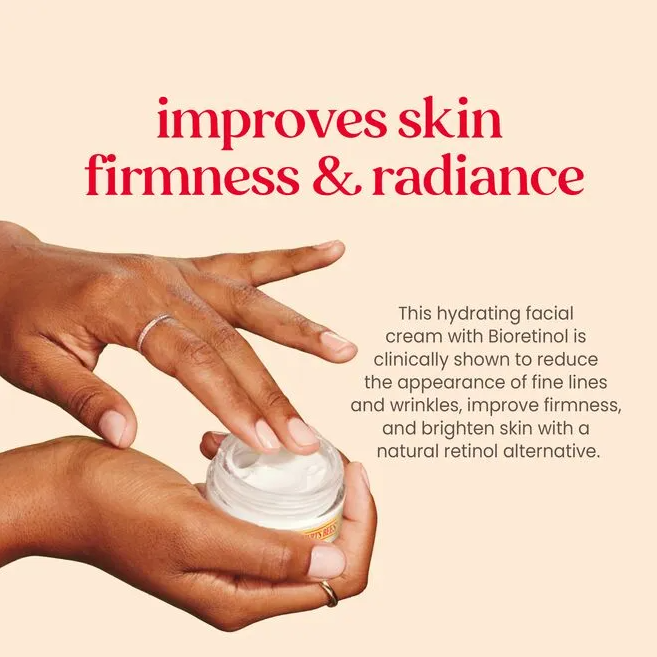 hands demonstrating anti aging moisturizing cream from burts bees which improves skin firmness and radiance reducing wrinkles with a natural retinol alternative
