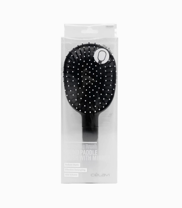 A package containing a Celavi "Pro Styling Brush / ROUND PADDLE BRUSH WITH MIRROR". "Reduce Static / Effective Detangling / Add Volume". Hair brush is black all over, except of the very tips of its bristles, which are white.