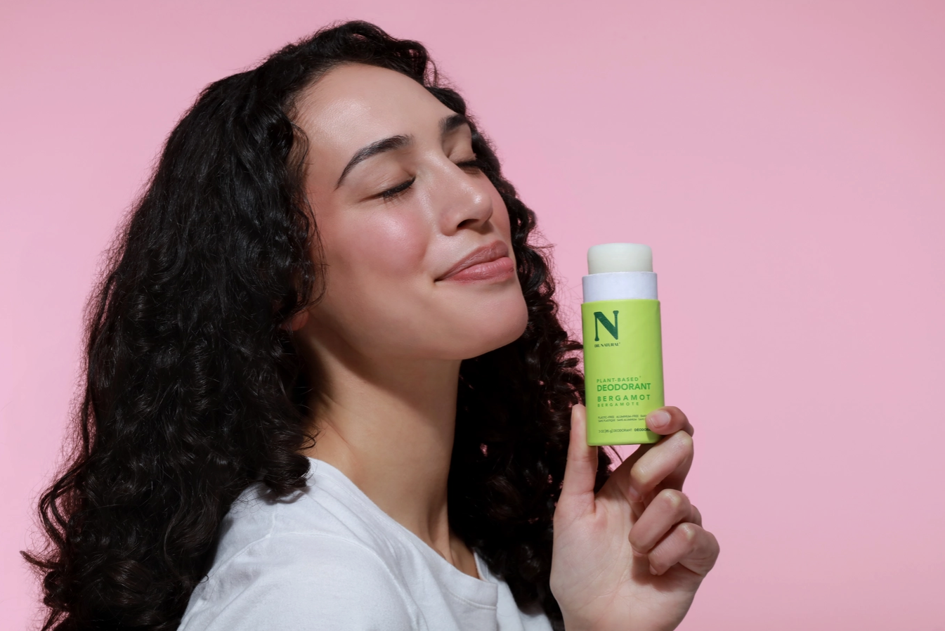 woman smelling bergamot scented plastic free natural deodorant zero waste