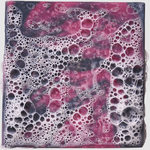 Heavy grit soap with a marbled design of pink, purple, and black colors