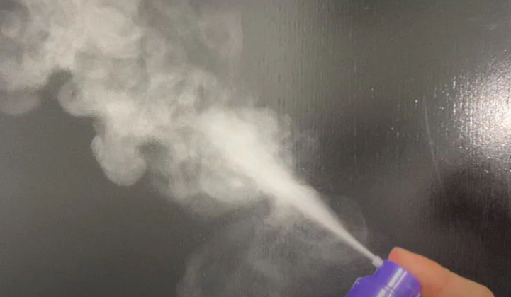 powder dry shampoo use demonstration spraying into air great for volumizing and quick refresh soaks up hair oils and is natural