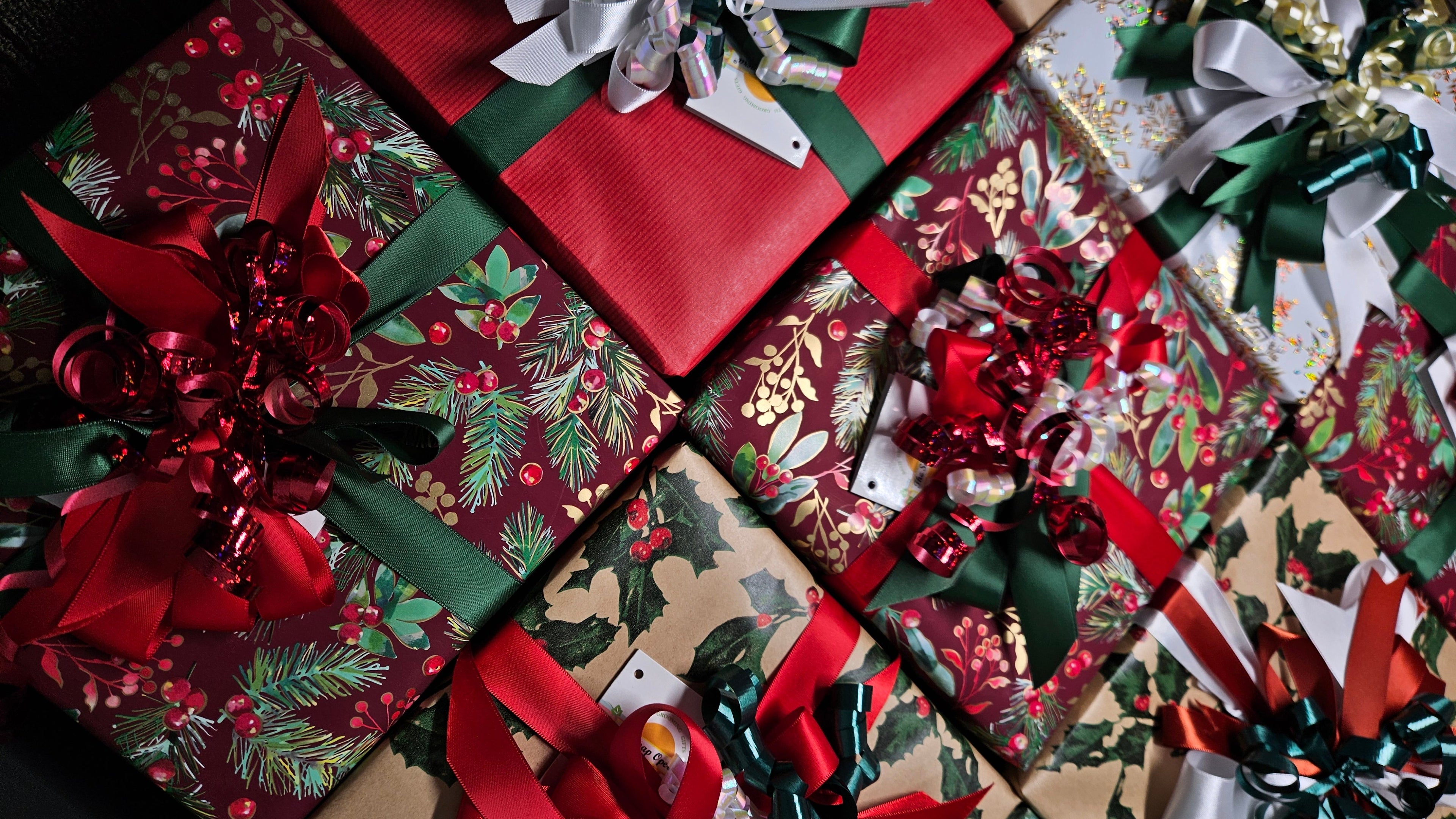 Collage of Christmas-themed gift boxes with ribbons and bows.