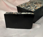 Bamboo Charcoal soap with Himalayan salt and rocks atop the loaf, jet black soap