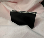 Slice of Primal Elements Charcoal Bamboo bar soap, jet black soap with Himalayan Salt and Rocks covering the top. 