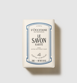 L'Occitane soap bar with blue and black text on a light gray background