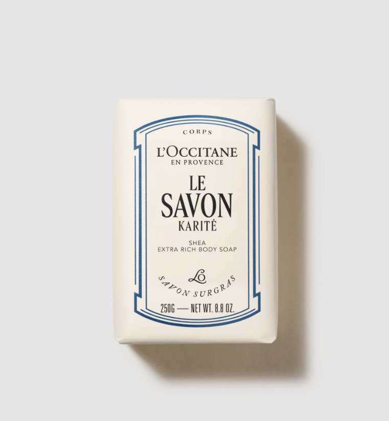 L'Occitane soap bar with blue and black text on a light gray background
