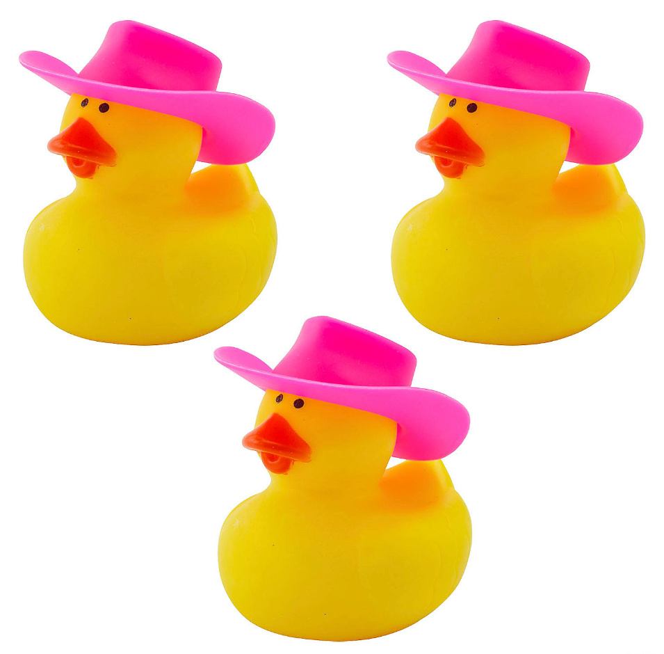Three small yellow rubber ducks wearing pink cowboy hats