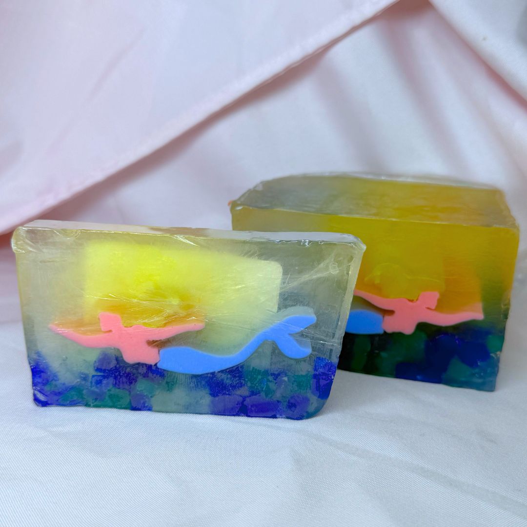 Colorful soap with a mermaid design on a white background blue rocks mermaid with loaf
