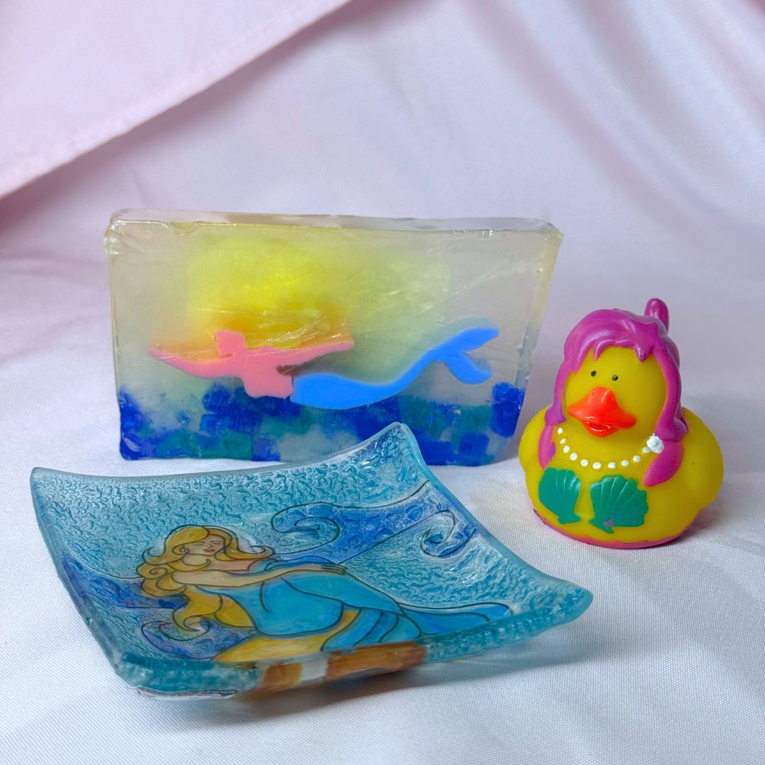 Colorful soap with a mermaid design on a white background blue rocks mermaid mermaid soap dish mermaid rubber ducky under the sea the little mermaid Ariel