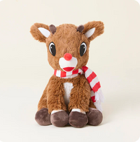 Plush reindeer toy with a red and white striped scarf on a light background