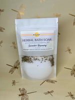 Herbal bath soak package with lavender and rosemary on a beige background with dragonfly designs.