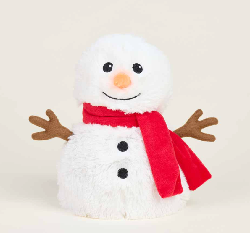 A white plush snowman wearing a red scarf. He has stick hands and a carrot nose, and is smiling.