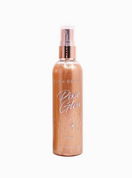 A tall spray bottle with a shimmery tan color. Holographic rainbow text reads "Pixie Glow".