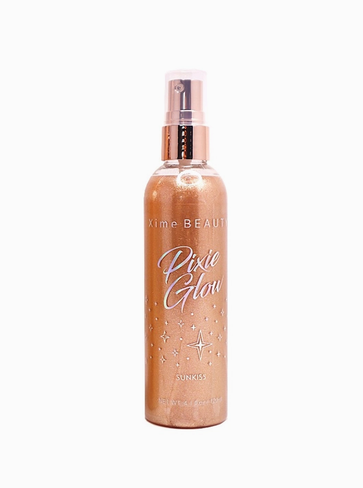 A tall spray bottle with a shimmery tan color. Holographic rainbow text reads "Pixie Glow".