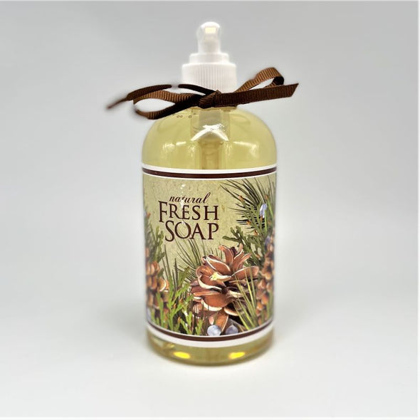 mary lake thompson liquid soap in pump bottle with brown ribbon and pinecone pine needle illustration. fresh juniper pine balsam scent. gift for holiday christmas.