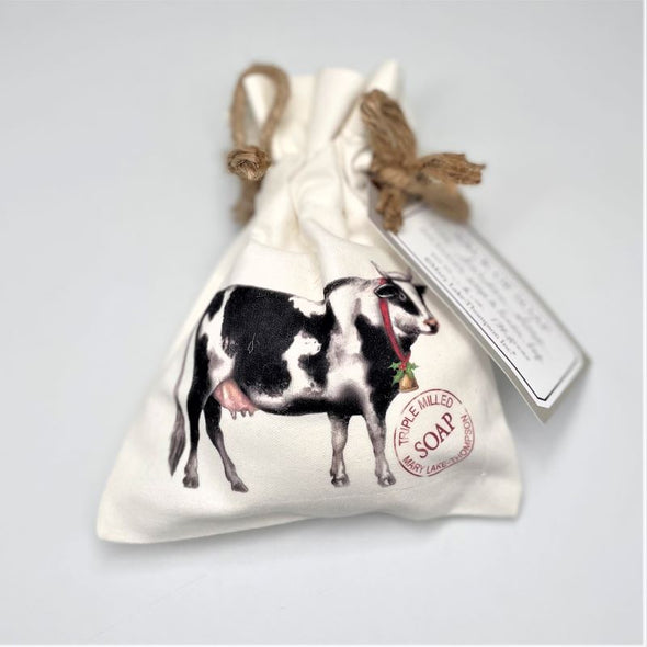mary lake thompson soap in white canvas bag with tie on top and christmas cow illustration on front