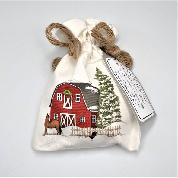 mary lake thompson soap in canvas bag tied at top gift for holiday christmas, with barn and snow illustration on front.