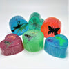 variety of colored glycerin bar soaps with plastic toy animals bugs for kids hearts circles